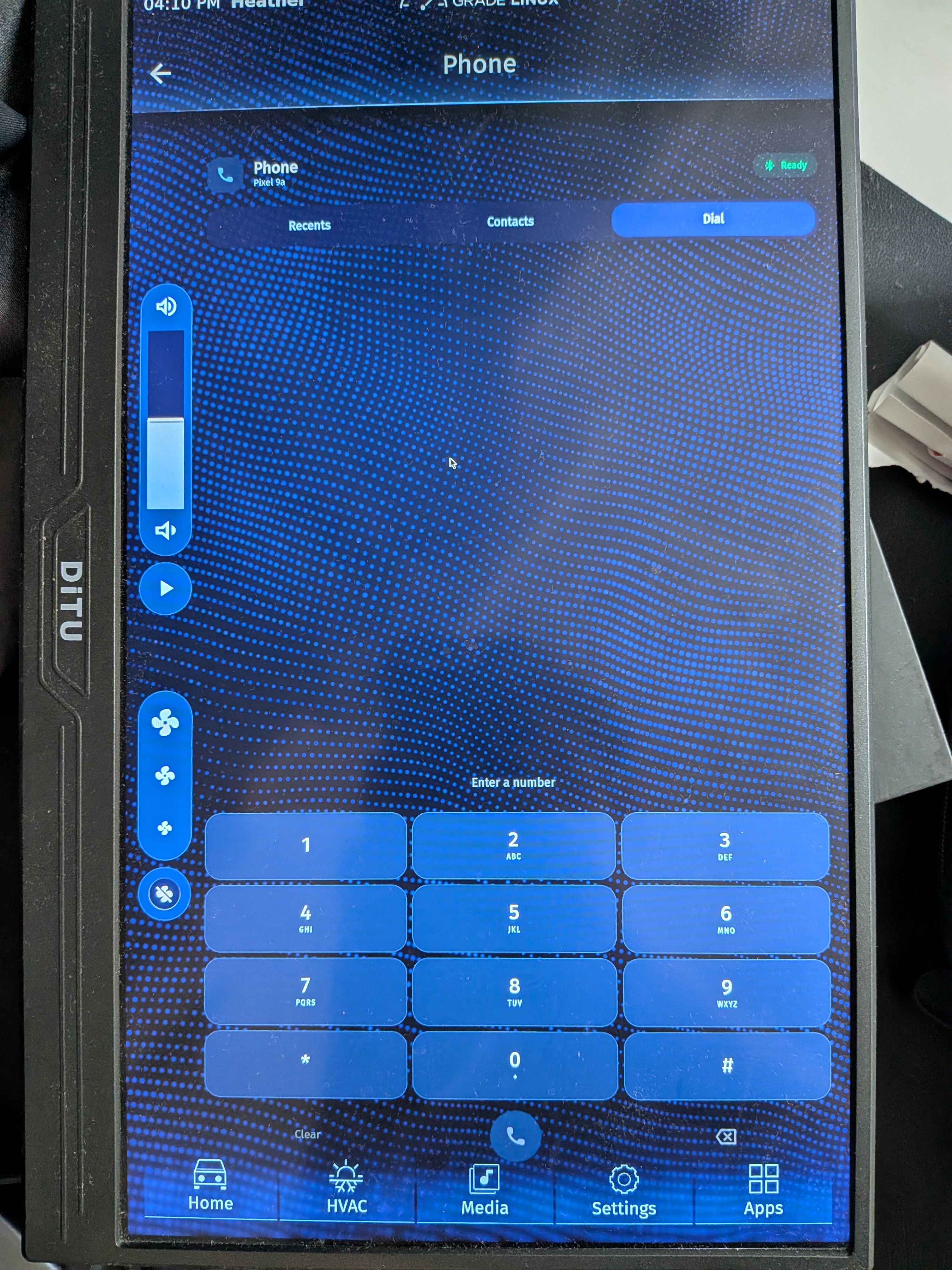 AGL Phone screen in Dial mode showing a connected Pixel 9a, Ready status, full numeric keypad, clear and delete controls, and call button.